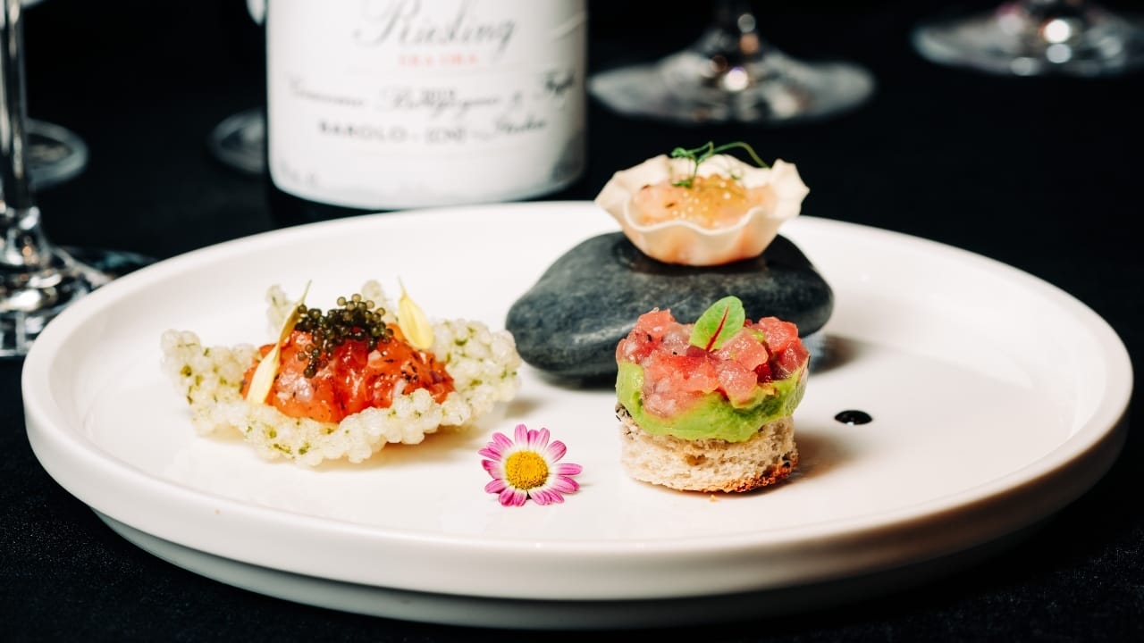 Trio Tartato: Smoked Salmon Tartare, Amaebi Tartare Limoncello Caviar, and Tuna Tarttare with Avocado Mousse.