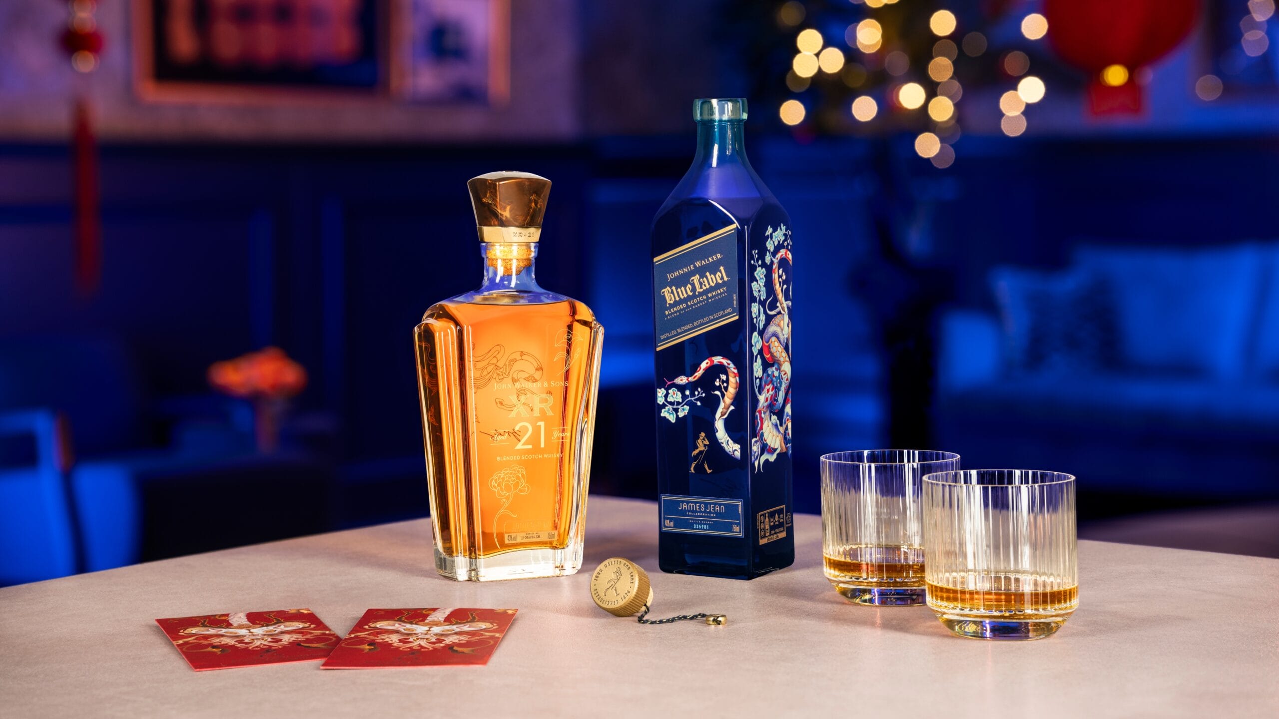 Johnnie Walker Blue Label's 2025 Lunar New Year edition showcases James Jean's artistry with three serpents symbolizing wisdom, intelligence, and intuition, intertwined with blooming flowers in a stunning celebration of renewal and prosperity.