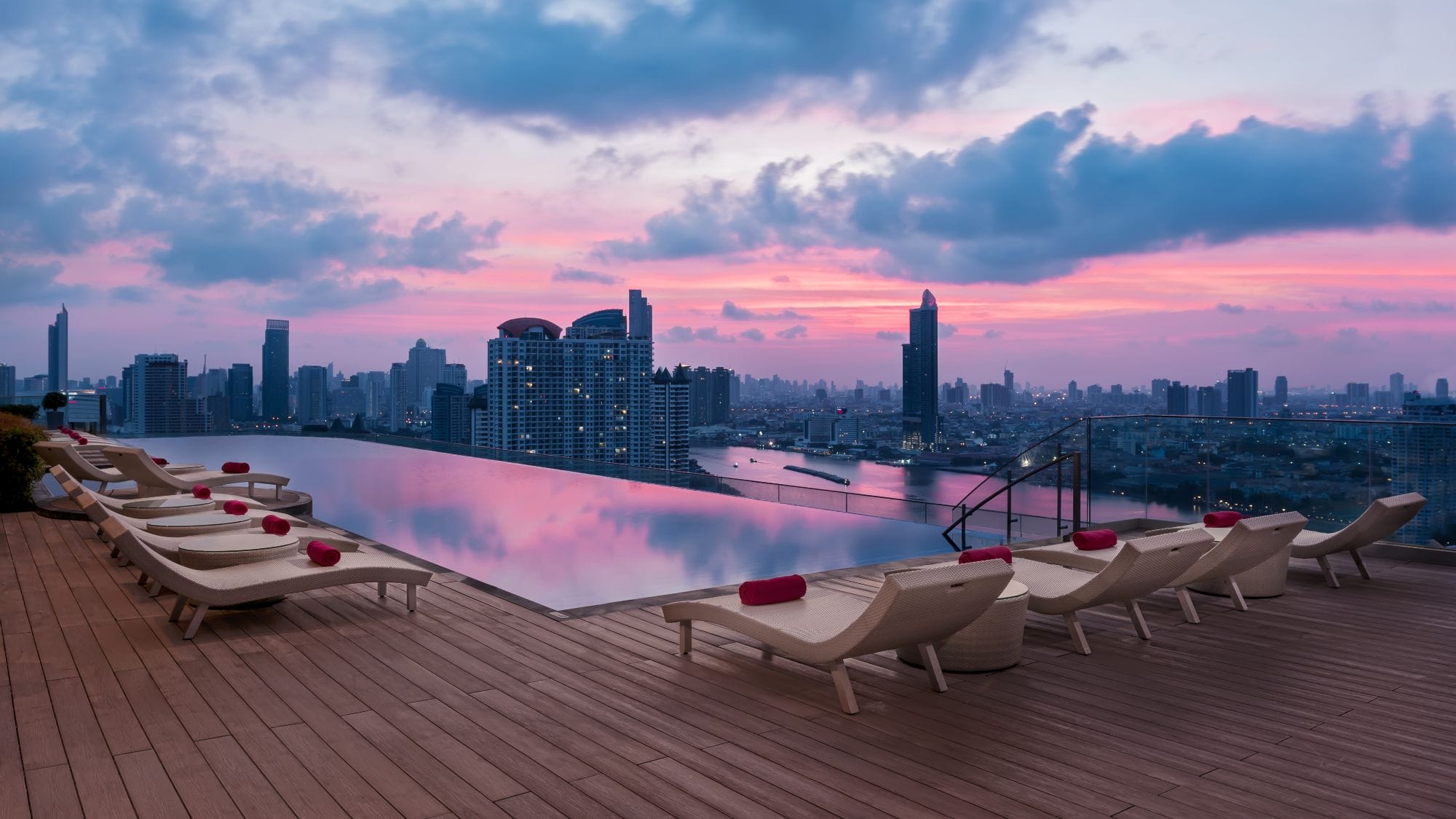 The hotel's swimming pool at sunset.