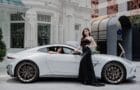 Models with the Aston Martin Vantage.