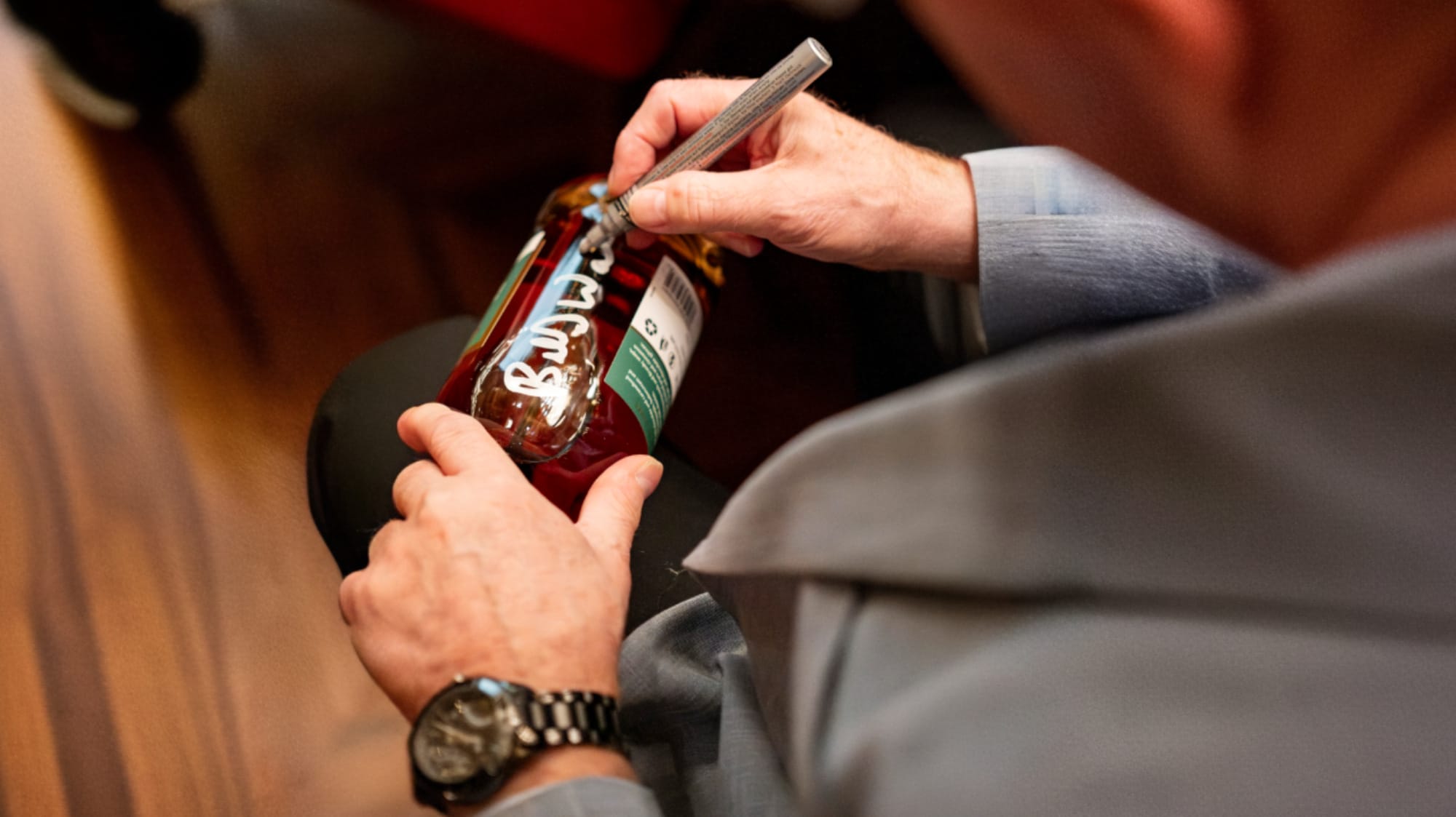 Walker adorns limited-edition bottles with his signature.