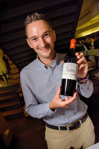 Sylvain Menard, business-development manager holding one the wines.